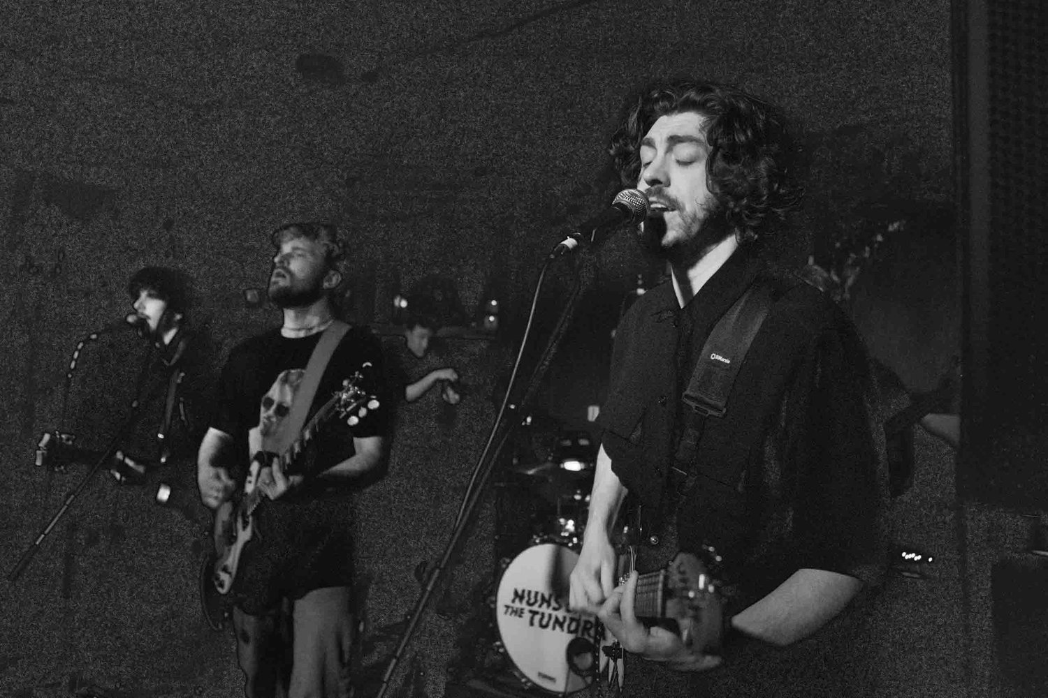 Low-light gig photograph showing thin shadows