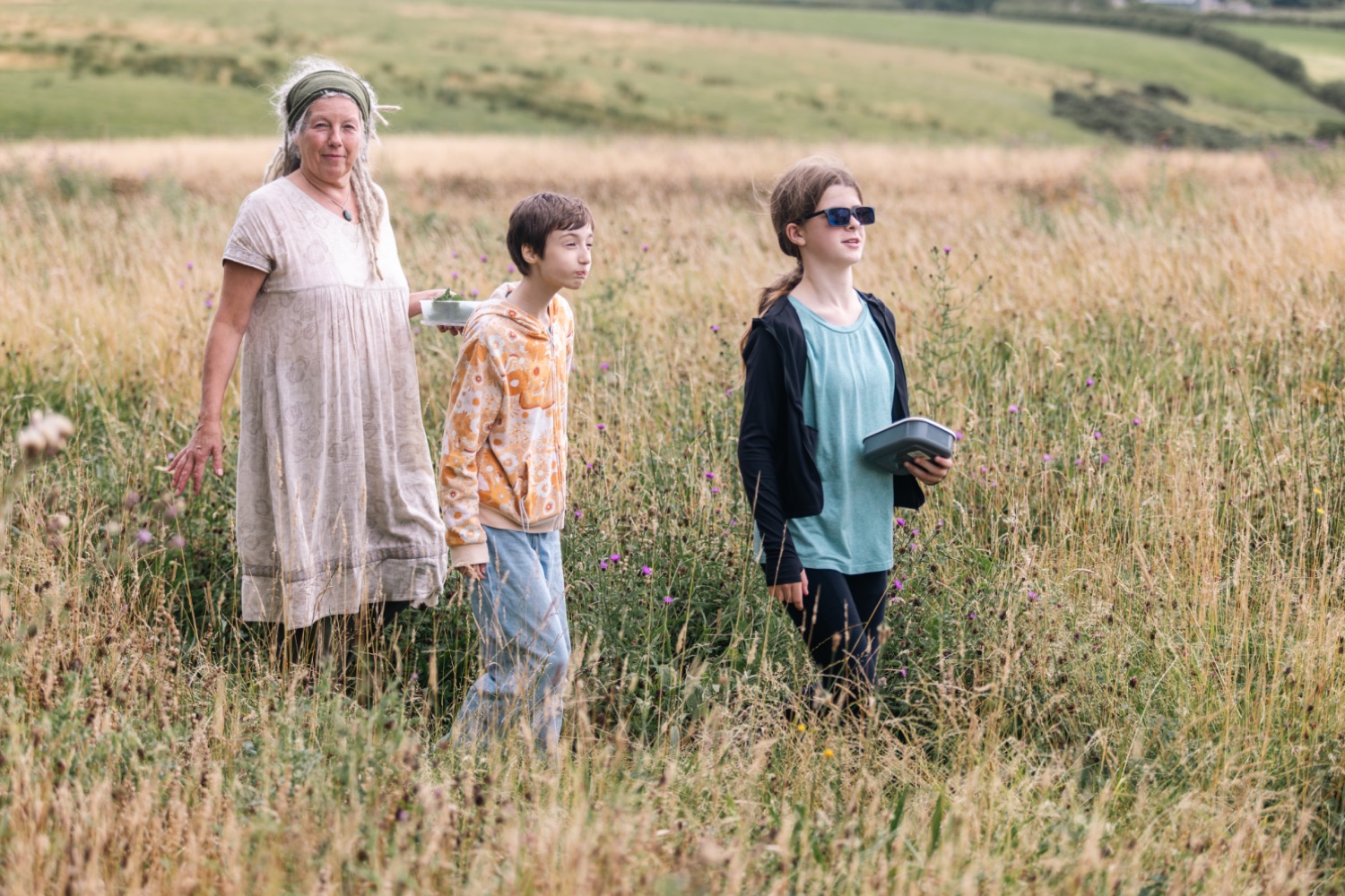 Young people foraging in the fields