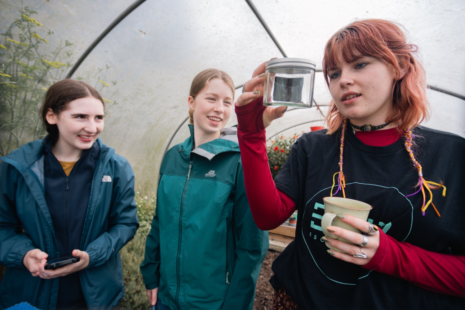 Young people examining moths
